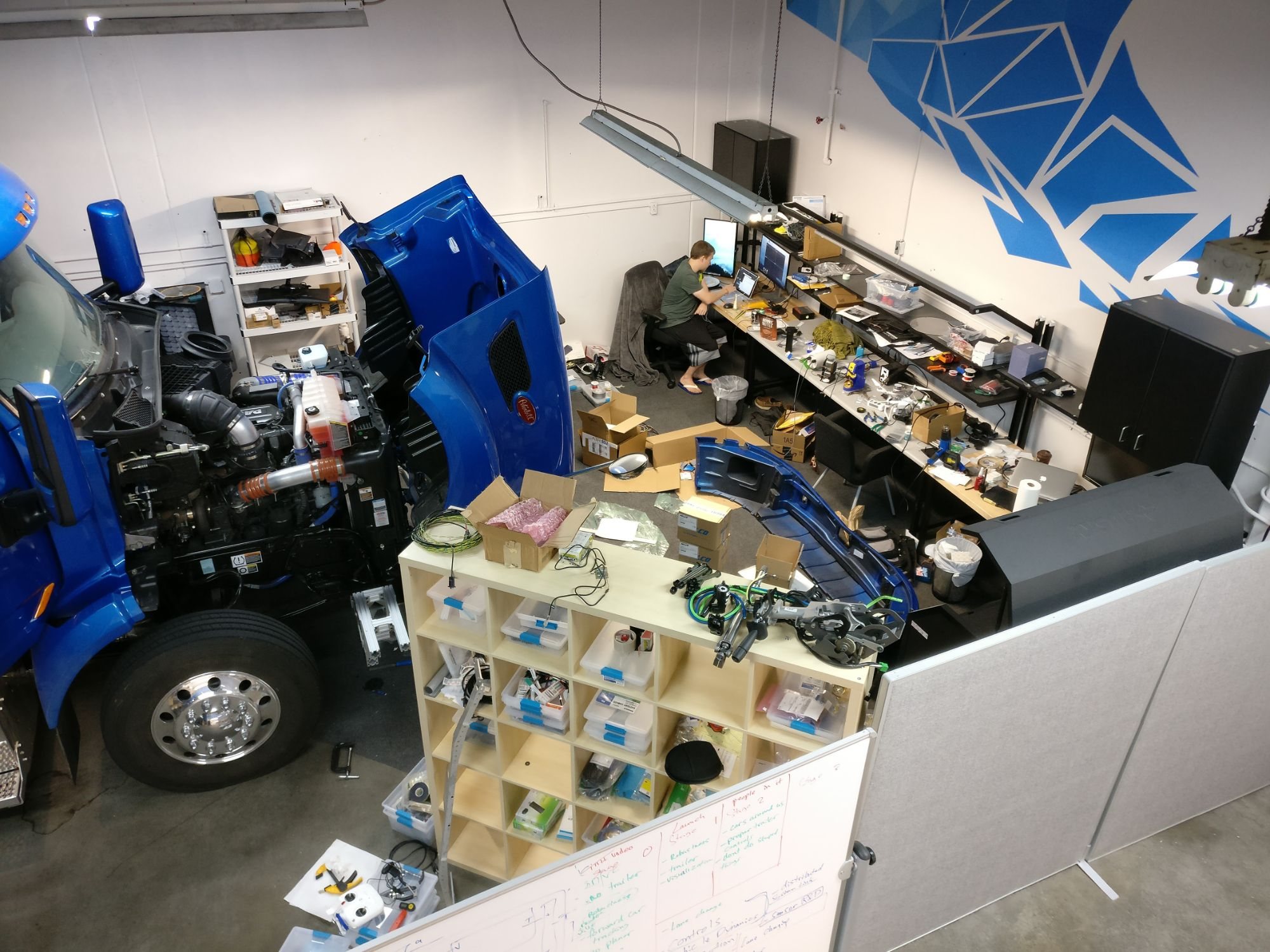 The Embark shop in 2016: the truck mid-integration and the power-steering unit
